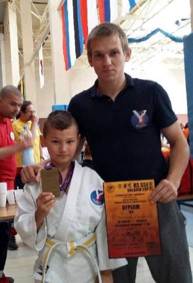 Mateusz z trenerem Tomkiem